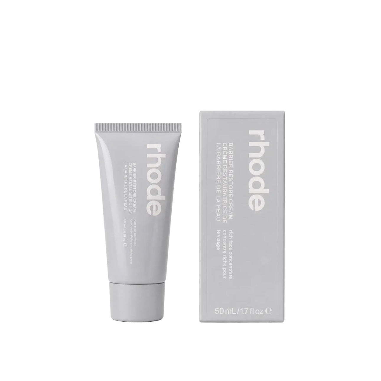 Gray tube and box of 'rhode' skincare product on a white background