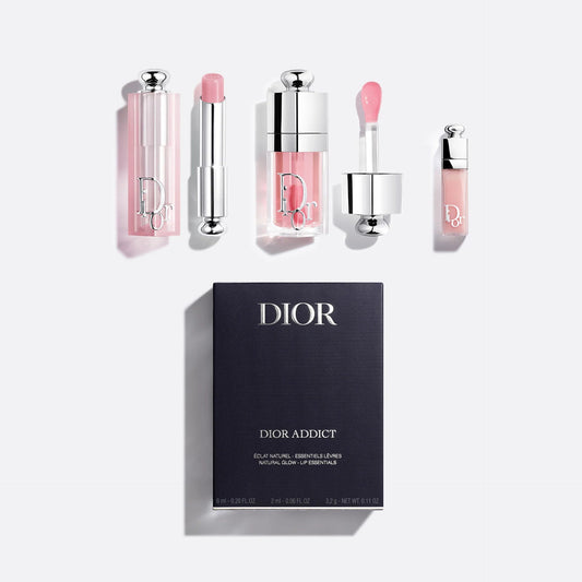 Dior makeup products including lipsticks and a gloss with a black Dior box on a white background.