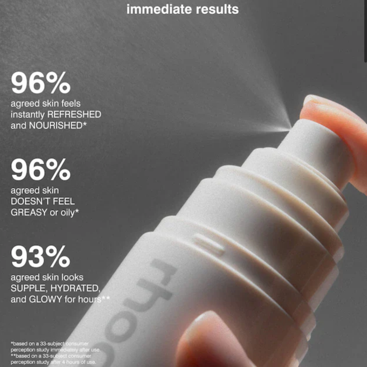 Hand holding a white spray bottle with text about skin benefits on a dark background