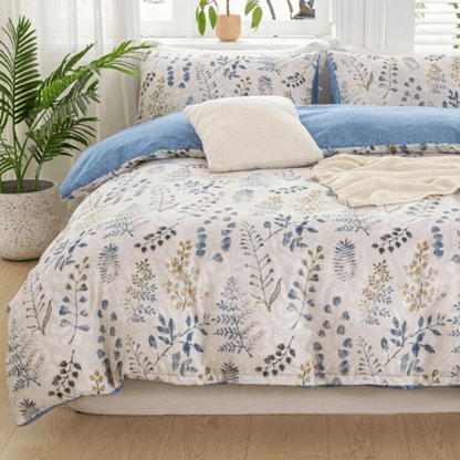 King size 6 piece bedding set, featuring a beautiful blue leaf design.