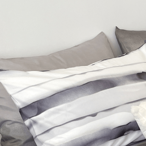 Queen size, 6-piece, reversible duvet cover set featuring a striped design in a vibrant gray color